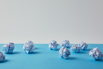 close-up shot of crumpled papers on blue surface