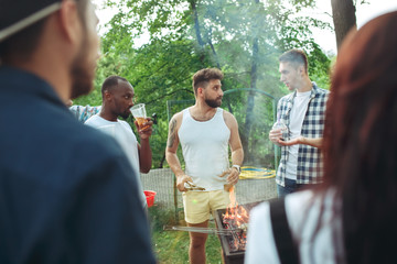 Group of friends making barbecue in the backyard. concept about good and positive mood with friends