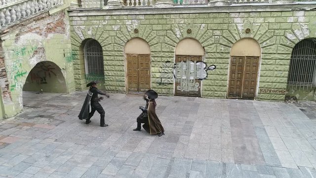 The musketeers are fighting fast in a duel