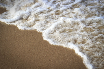 White sea foam and sand, texture, natural background, copy space