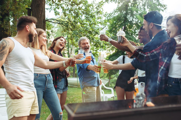 Group of friends making barbecue in the backyard. concept about good and positive mood with friends