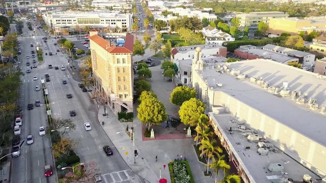 Aerial: Fly over city center at sun set.