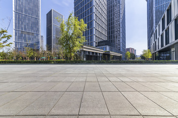 Panoramic skyline and modern business office buildings with empty road,empty concrete square floor