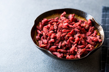 Organic Dried Goji Berries in Ceramic Bowl.