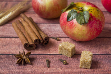 Fresh red apples, spicy spices cinnamon, anise and cloves. Autumn concept
