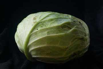 Fototapeta premium Cabbage vegetables on black ground