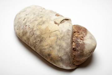 homemade wholemeal bread well baked on a white background