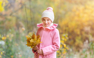 little girl in an autumn forest