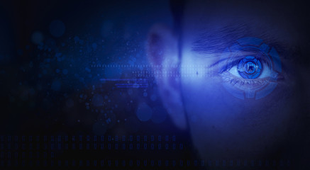 The eye of a man, an additional reality in the form of a holographic display, neon light, optical flores. Abstract dark background, bokeh.