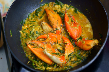 Crab cook in curry fried in pan in kitchen