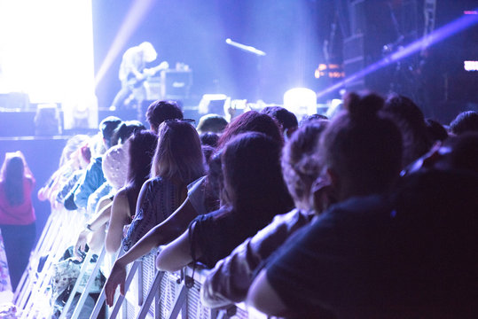 Crowd at concert, stage lights