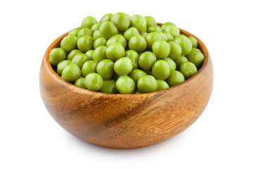 Green peas in a wooden bowl, isolated on white background