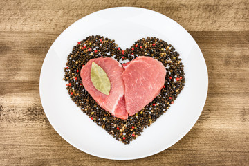 Raw meat in the shape of a heart.