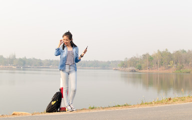 Woman listening music in outdoor relax time.