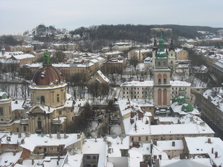 Beautiful view of the center of Lviv from the town hall in winter with beautiful houses and snow