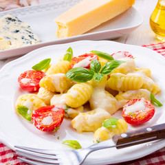 delicious gnocchi with gorgonzola cream sauce and cherry tomatoes