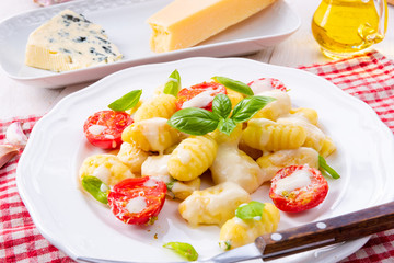 delicious gnocchi with gorgonzola cream sauce and cherry tomatoes