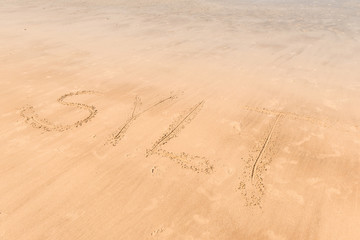 Fototapeta na wymiar Inscription Sylt on the beach sand. The island of Sylt, Germany.