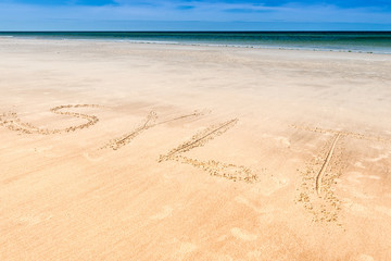 Inscription Sylt on the beach sand. The island of Sylt, Germany.