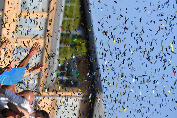 Colorful paper snippets in the air on the christopher street day 2018 in Berlin-Germany.