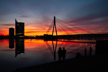 Fototapeta premium Sunset at the bridge on the Daugava River in Riga