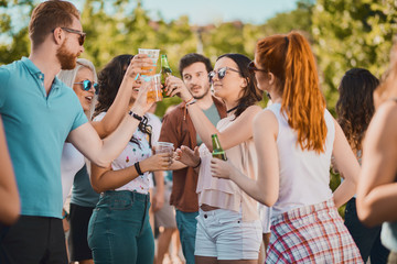 Group of people dancing and having a good time at the outdoor party/music festival 