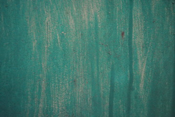A green metal background with different divorces and shades on it