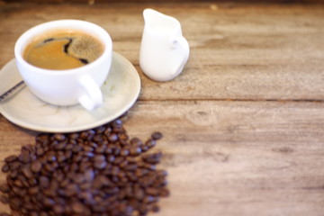 Hot coffee on wooden background