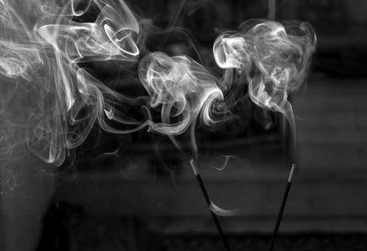 smoke rising from insense sticks