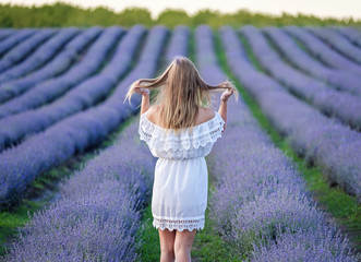 Girl walks on lavender field 3