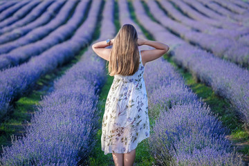 Girl walks on lavender field 4