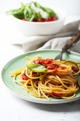 Traditional itaian spaghetti with tomato and zucchini