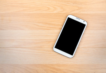 Smart phone on wooden background