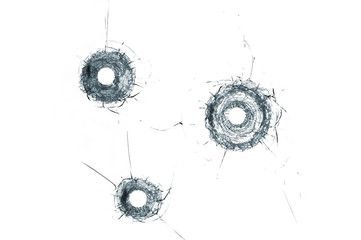 Broken glass triple bullet holes in glass isolated on white