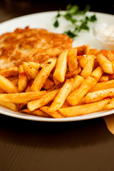 Vienna schnitzel and French fries. Traditional Austrian dish.