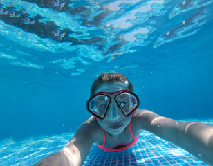 A diving girl in the swimming pool