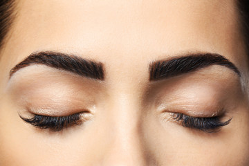 Young woman with permanent eyebrows makeup, closeup