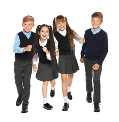 Little children in stylish school uniform on white background