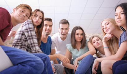 Fototapeta premium People sitting together indoors. Unity concept