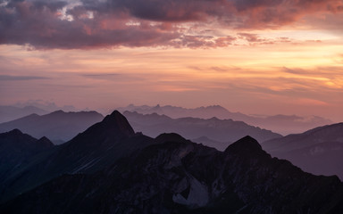 dramatic sunset over mountain range in the swiss alps