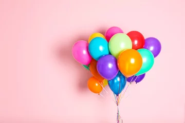 Foto op Canvas Bunch of bright balloons on color background with space for design © New Africa