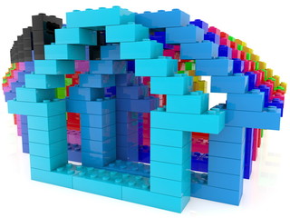 Concepts with colorful houses of play bricks
