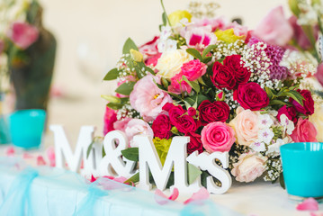 Wedding table decoration . Mr and Mrs sign and fresh flower decoraton 