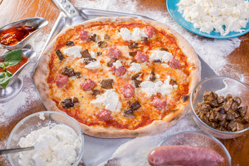 close up of tasty italian sausage pizza with mushrooms