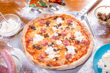 close up of tasty italian sausage pizza with mushrooms
