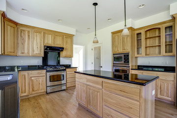 Spacious kitchen room with wooden center island.