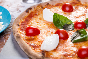 tasty close up of fresh margherita pizza with mozzarella