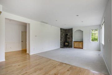 White family room with stone fireplace.