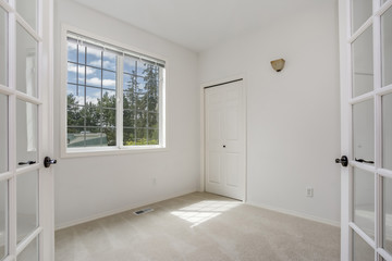 Empty room with pure white walls.