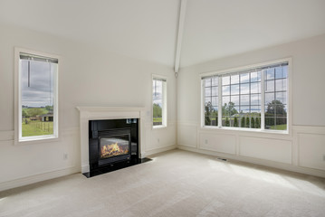 White empty living room filled with sunlight.